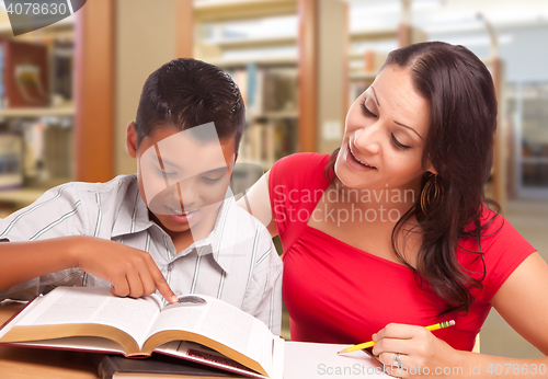 Image of Hispanic Mother and Son Studying In Library