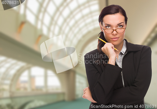 Image of Serious Businesswoman Inside Corporate Building