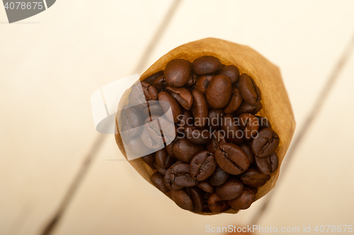 Image of espresso coffee beans on a paper cone
