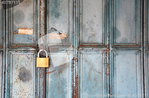 Image of Metal lock on a blue door