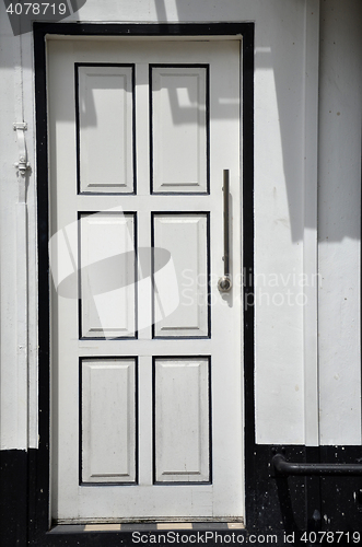 Image of White wall with white door