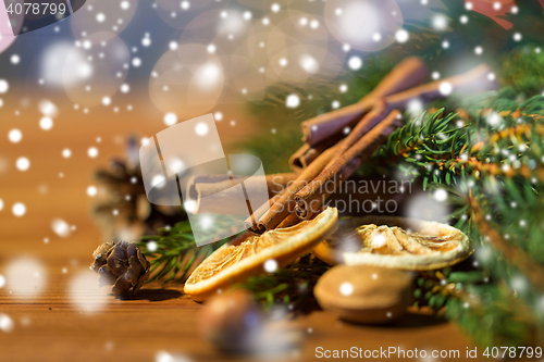 Image of christmas fir branch, cinnamon and dried orange