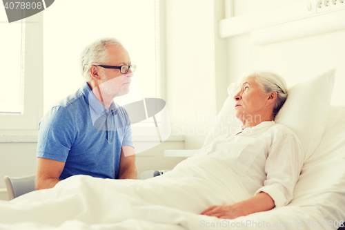 Image of senior couple meeting at hospital ward