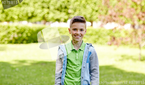 Image of happy smiling boy at summer park
