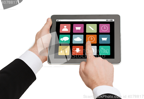 Image of close up of hands holding tablet pc with app icons