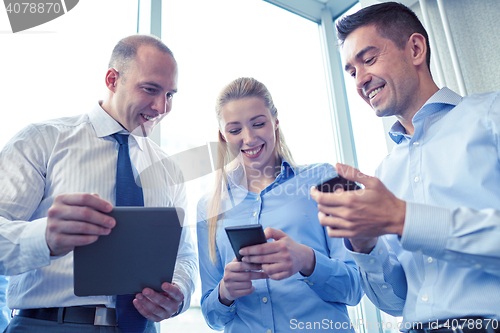 Image of business people with tablet pc and smartphones