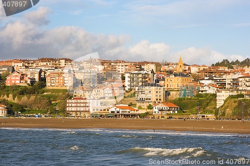 Image of Beach in the village color houses in blue sky