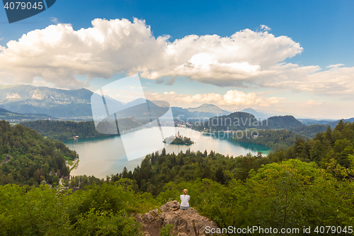 Image of Woman enjoying panoramic view of Lake Bled, Slovenia.