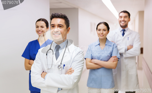 Image of group of happy medics or doctors at hospital