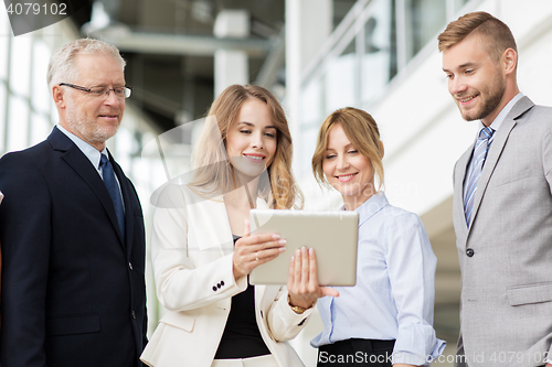 Image of business people with tablet pc computers at office
