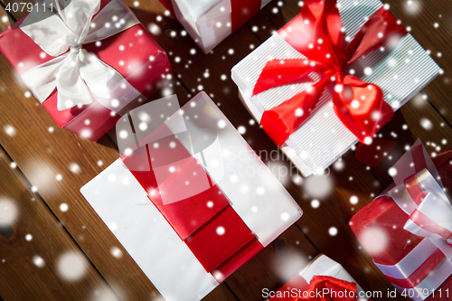 Image of close up of gift boxes on wooden floor from top