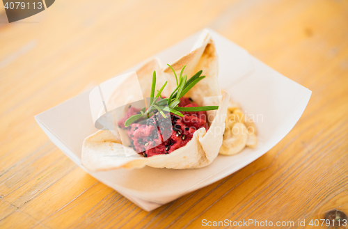 Image of close up of dough cornet with beetroot filling