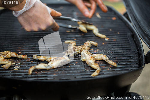 Image of close up of frog meat grill at street market