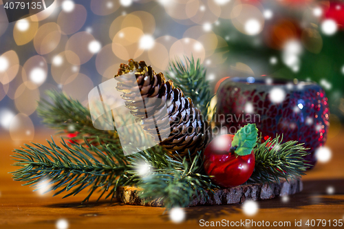 Image of christmas fir branch decoration and candle lantern