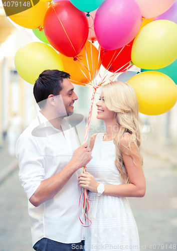 Image of couple with colorful balloons