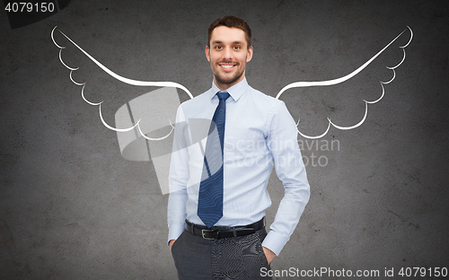 Image of happy businessman with angel wings over gray