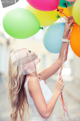 Image of woman with colorful balloons