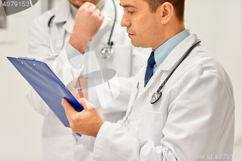 Image of close up of doctors with clipboard at hospital