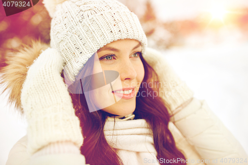 Image of happy woman outdoors in winter