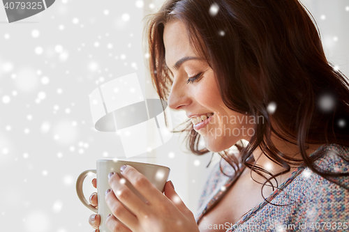 Image of close up of woman with tea cup or coffee