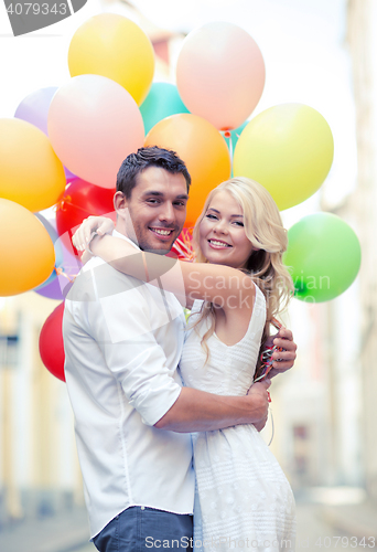 Image of couple with colorful balloons