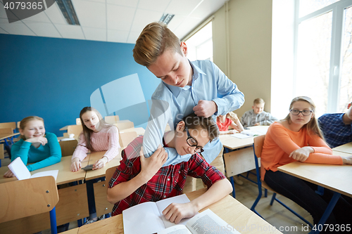 Image of student boy suffering of classmate mockery