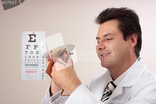 Image of Optometrist cleaning glasses