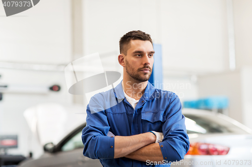 Image of auto mechanic man or smith at car workshop