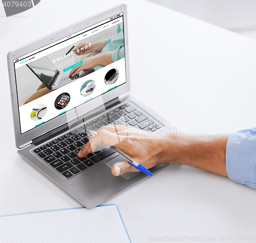 Image of businessman with laptop computer working at office