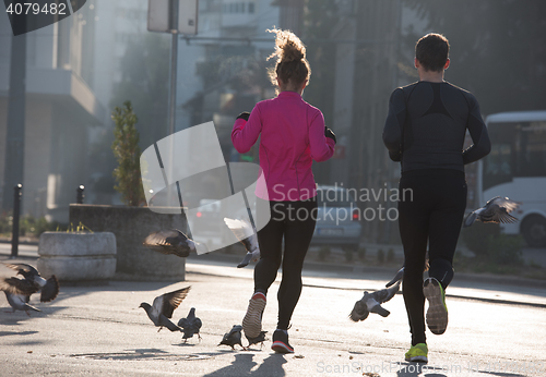 Image of young  couple jogging