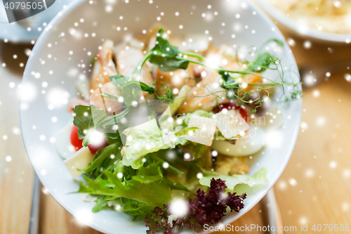 Image of close up of caesar salad on plate at restaurant