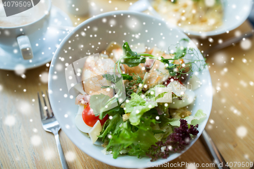 Image of close up of caesar salad on plate at restaurant