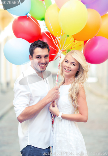 Image of couple with colorful balloons