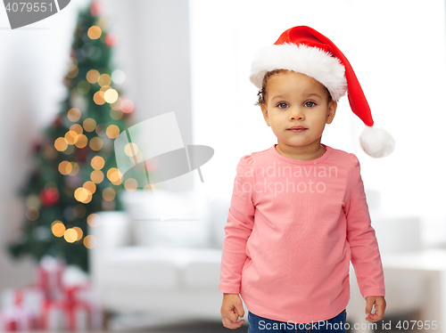 Image of beautiful little baby girl in christmas santa hat