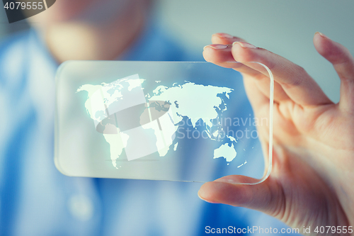 Image of close up of woman with transparent smartphone