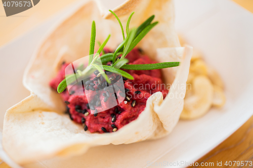 Image of close up of dough cornet with beetroot filling