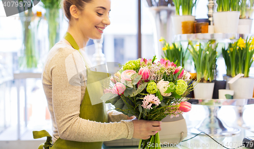 Image of close up of woman making bunch at flower shop