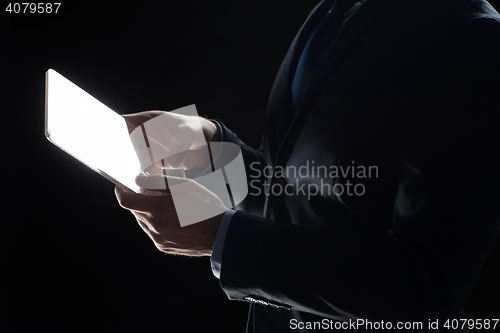 Image of close up of businessman with transparent tablet pc