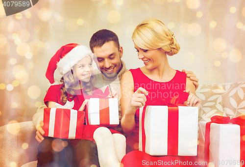 Image of happy family opening gift boxes