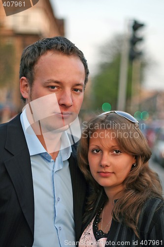 Image of The young beautiful couple in the street