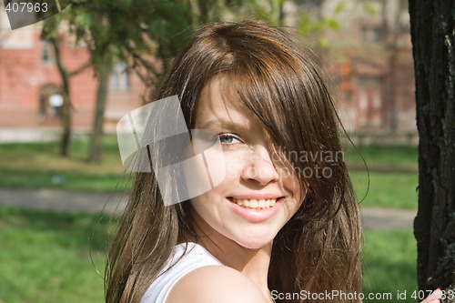 Image of Portrait of the smiling beauty girl outdoor