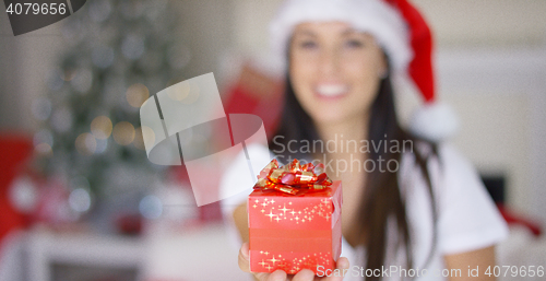 Image of Decorative red Christmas gift with a bow