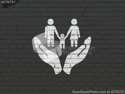 Image of Insurance concept: Family And Palm on wall background