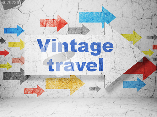 Image of Vacation concept: arrow with Vintage Travel on grunge wall background