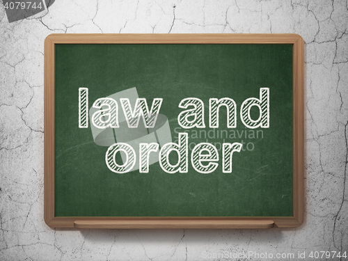 Image of Law concept: Law And Order on chalkboard background