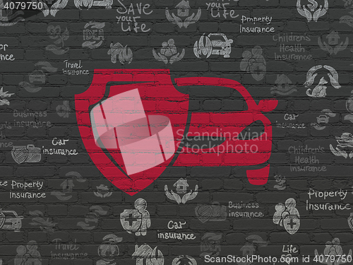 Image of Insurance concept: Car And Shield on wall background