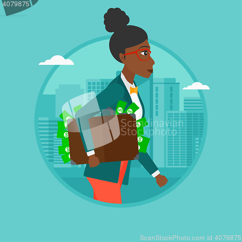 Image of Business woman carrying briefcase full of money.