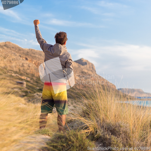 Image of Free active man enjoying beauty of nature.