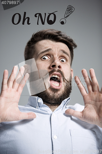 Image of Man in a fright. Over gray background