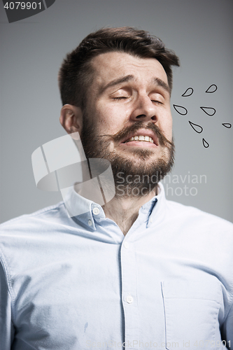 Image of The crying man with tears on face closeup